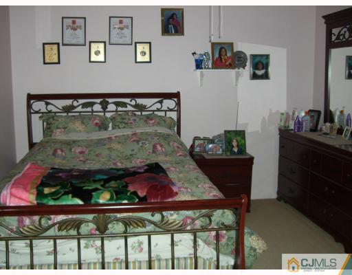 40 Brookside Road Edison, NJ 08817 - Photo 8 of 8 a view of a room that has a table and chairs in it