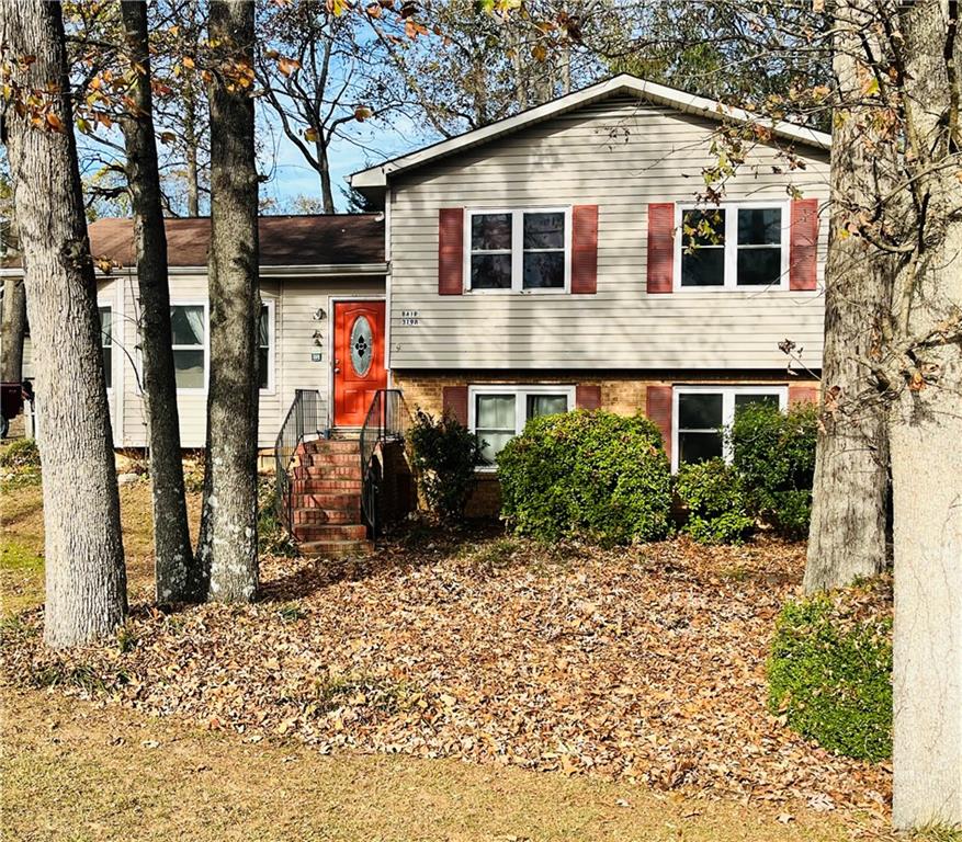 3198 Pate Road Snellville, GA 30078 - Photo 1 of 1 a front view of a house with a yard
