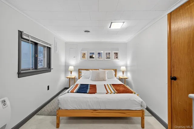 a bedroom with a bed and a dresser