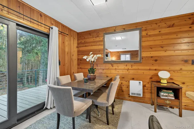 a view of an entryway with wooden floor and door