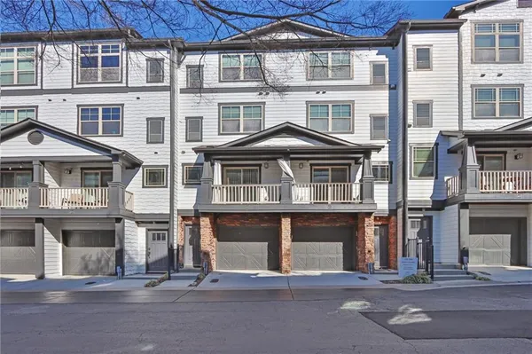a front view of a building with a lot of windows