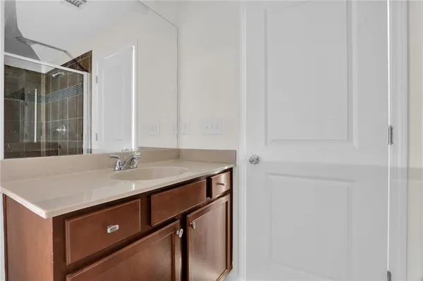a bathroom with a sink and vanity