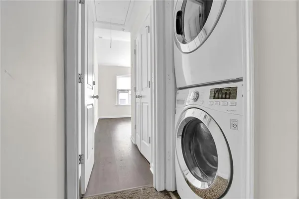 a view of a hallway with washer and dryer