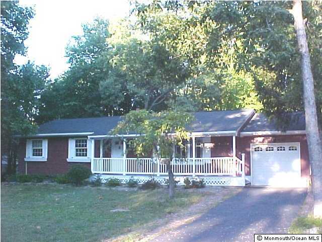 526 Diamond Road Jackson, NJ 08527 - Photo 1 of 3 a view of a yard in front of a house with large trees