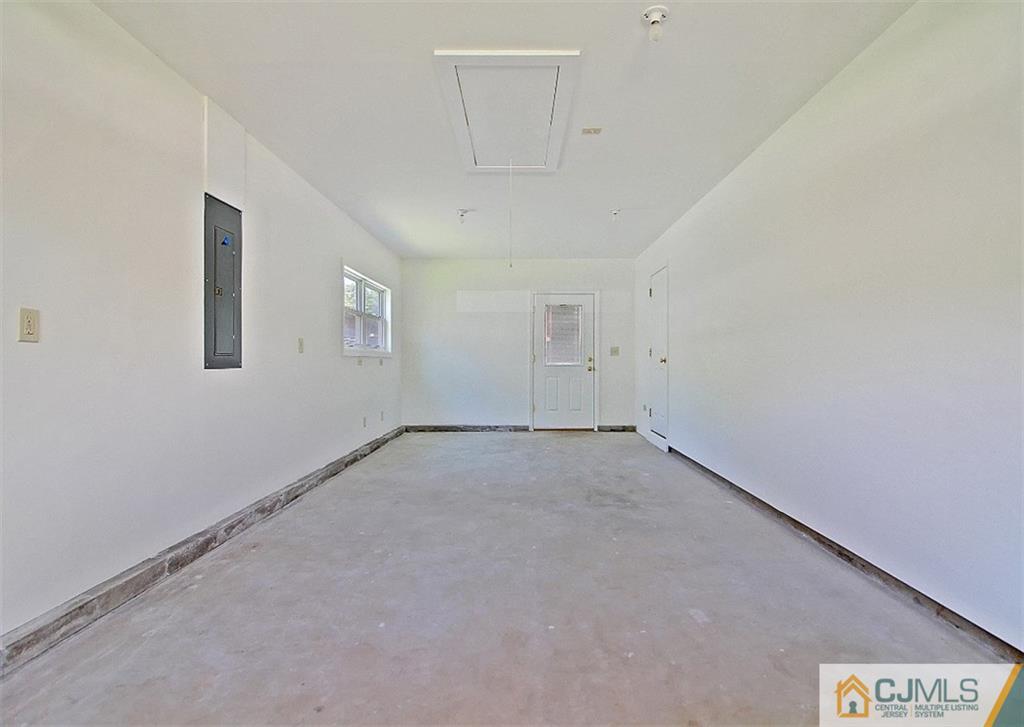 32 Ramsey Road Middlesex, NJ 08846 - Photo 13 of 25 an empty room with a empty space and windows