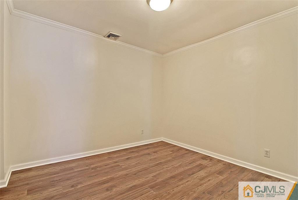 32 Ramsey Road Middlesex, NJ 08846 - Photo 15 of 25 a view of a room with wooden floor