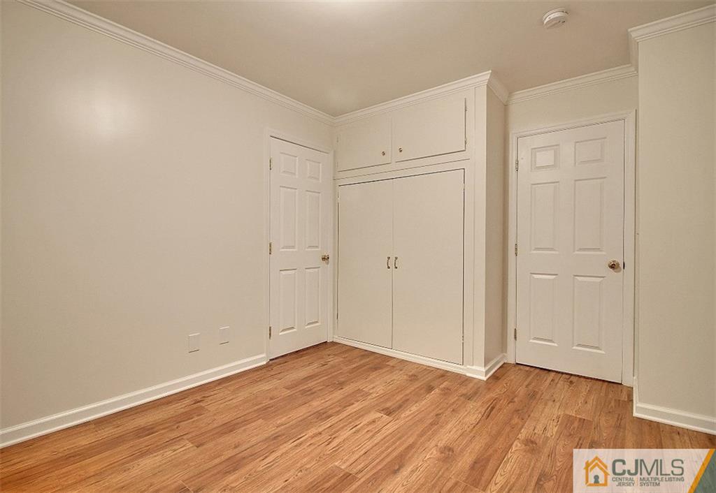 32 Ramsey Road Middlesex, NJ 08846 - Photo 16 of 25 a view of an empty room with wooden floor
