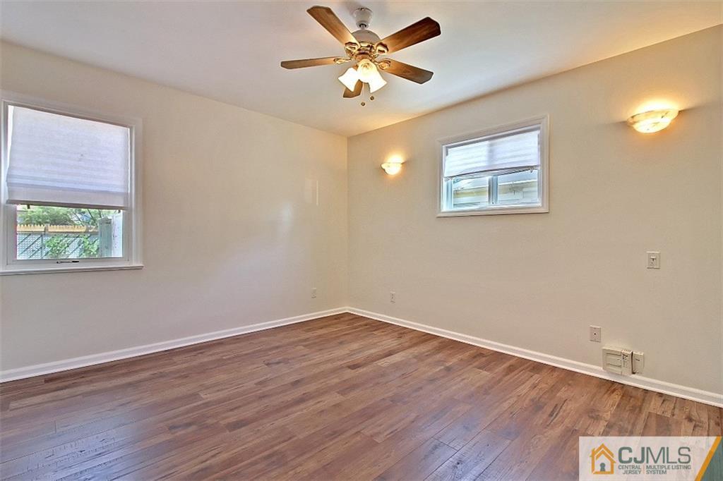 32 Ramsey Road Middlesex, NJ 08846 - Photo 17 of 25 a view of an empty room with window and wooden floor
