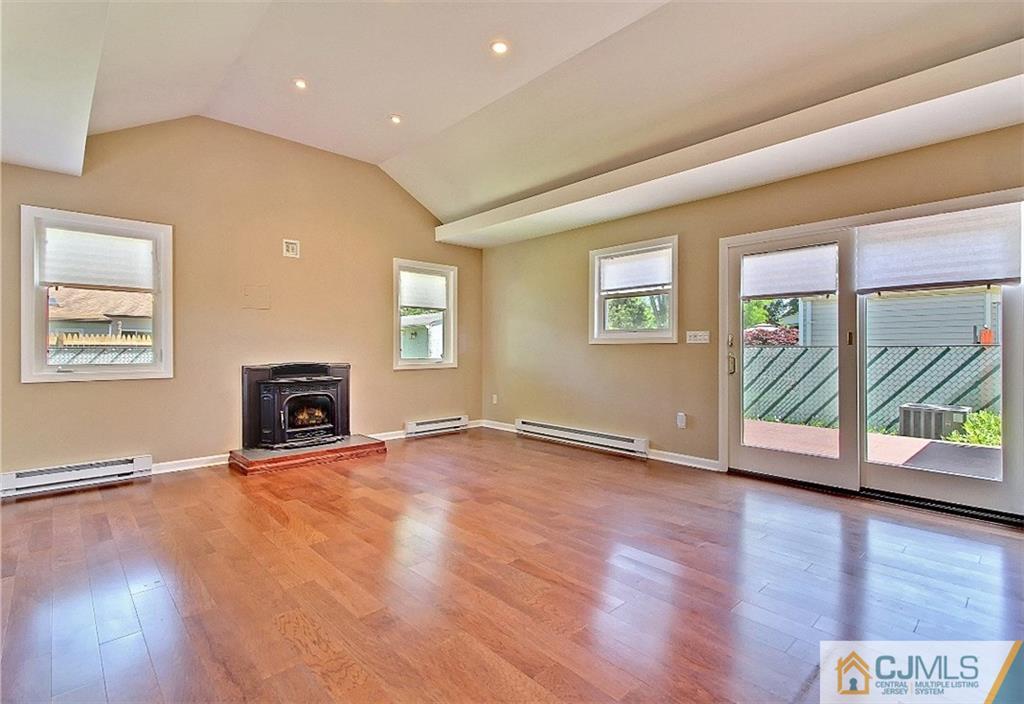 32 Ramsey Road Middlesex, NJ 08846 - Photo 3 of 25 a view of an empty room with a window and wooden floor