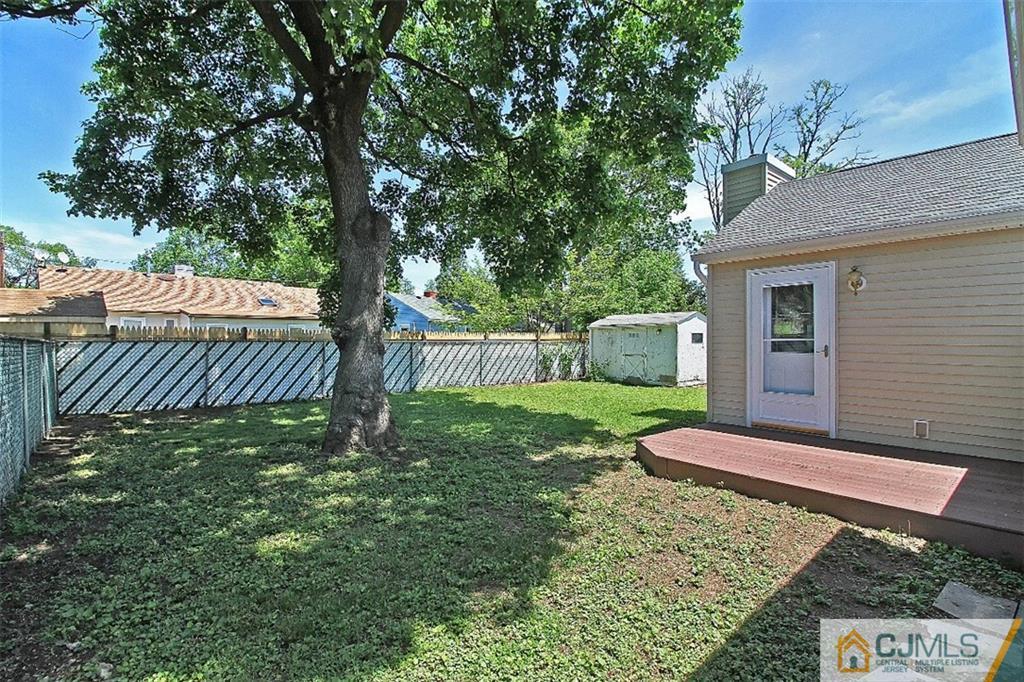 32 Ramsey Road Middlesex, NJ 08846 - Photo 21 of 25 a view of a backyard with a house and a small yard