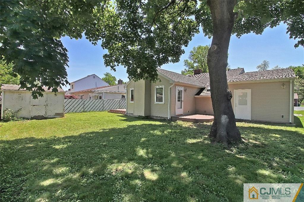 32 Ramsey Road Middlesex, NJ 08846 - Photo 22 of 25 a front view of a house with a garden and yard