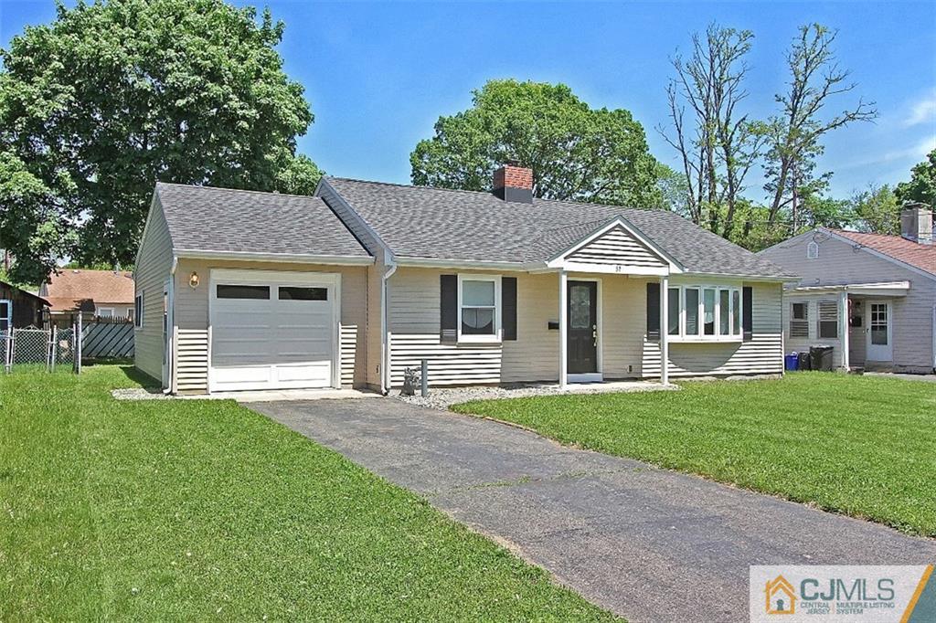 32 Ramsey Road Middlesex, NJ 08846 - Photo 24 of 25 a front view of a house with a garden and yard