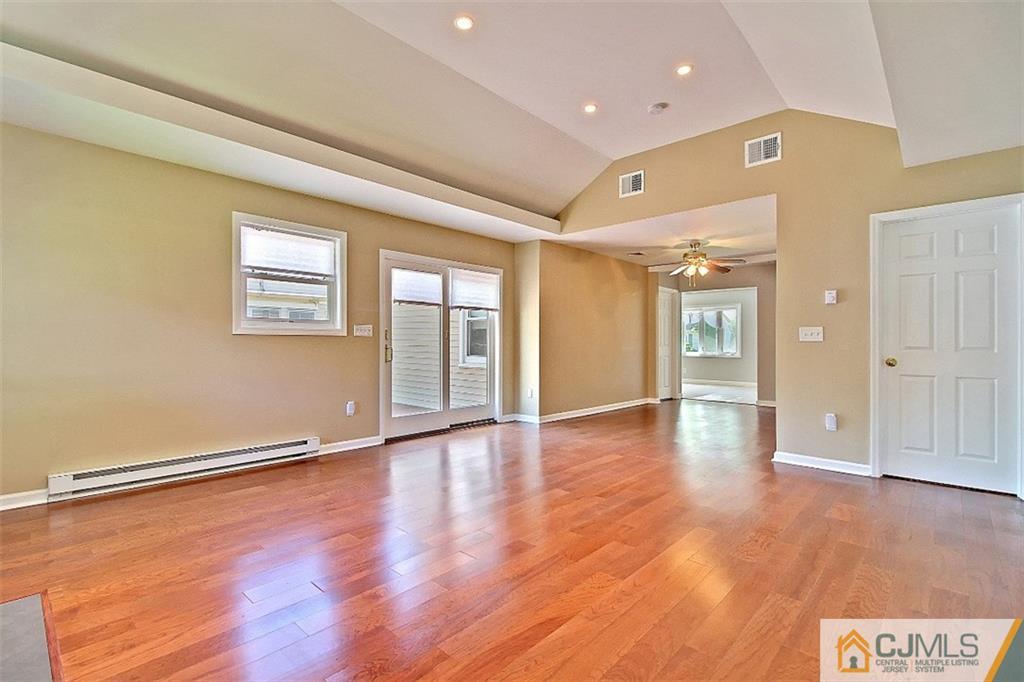 32 Ramsey Road Middlesex, NJ 08846 - Photo 9 of 25 wooden floor in an empty room with a window