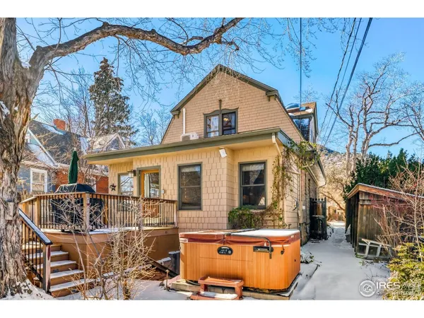 a view of a house with wooden fence