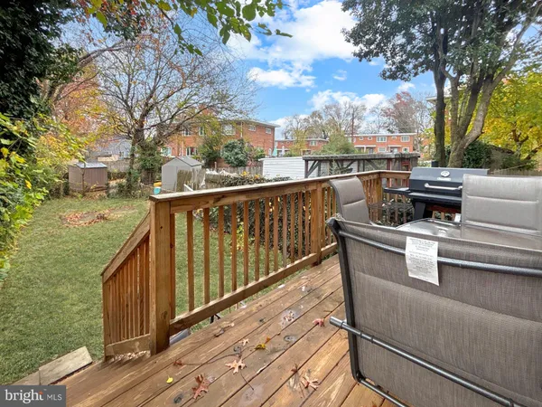 a balcony with wooden floor and fence