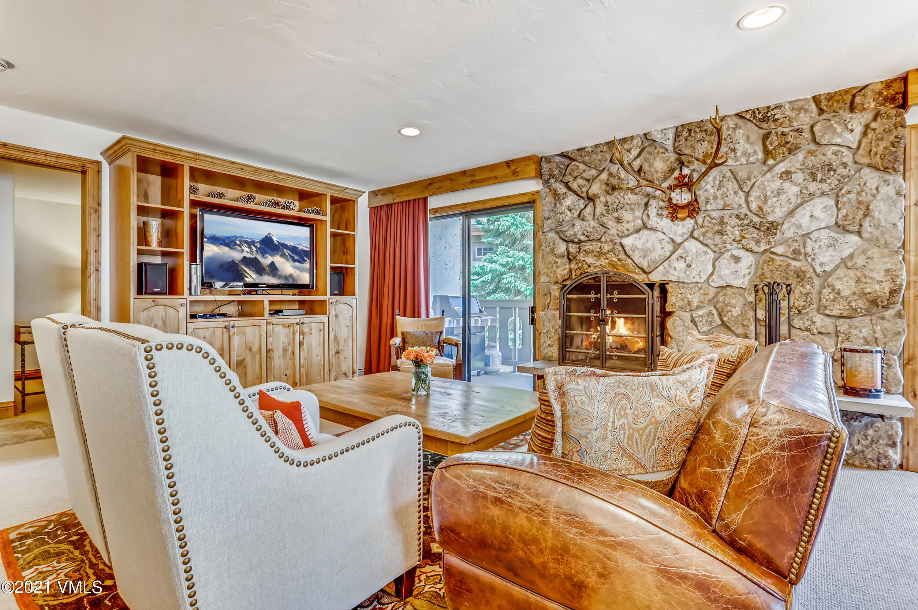 133 Willow Bridge Road, Unit 625 Vail, CO 81657 - Photo 2 of 26 a living room with furniture and large window