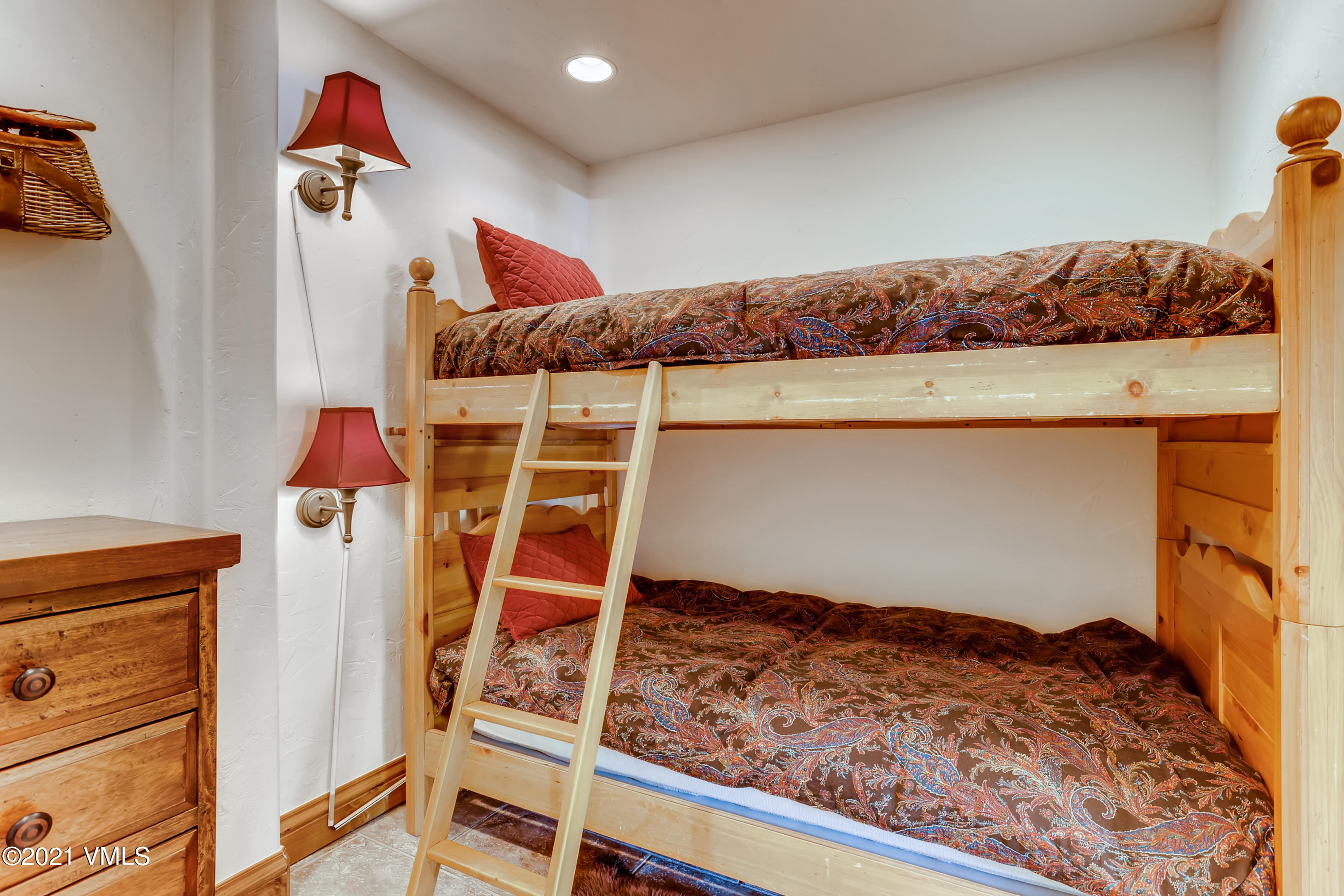 133 Willow Bridge Road, Unit 625 Vail, CO 81657 - Photo 22 of 26 a bed room with a bed and a couch