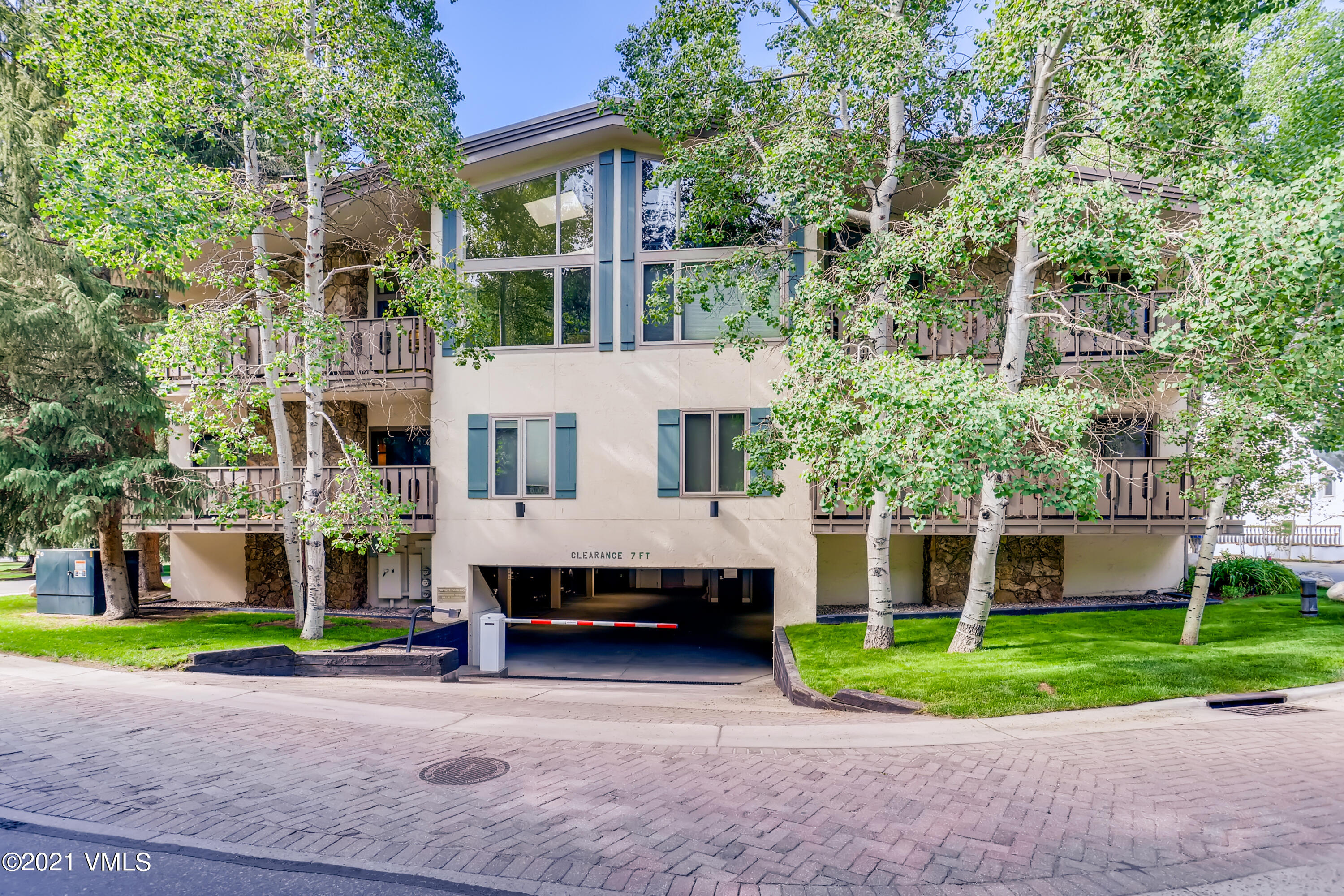 133 Willow Bridge Road, Unit 625 Vail, CO 81657 - Photo 25 of 26 a view of a house with a yard and tree s