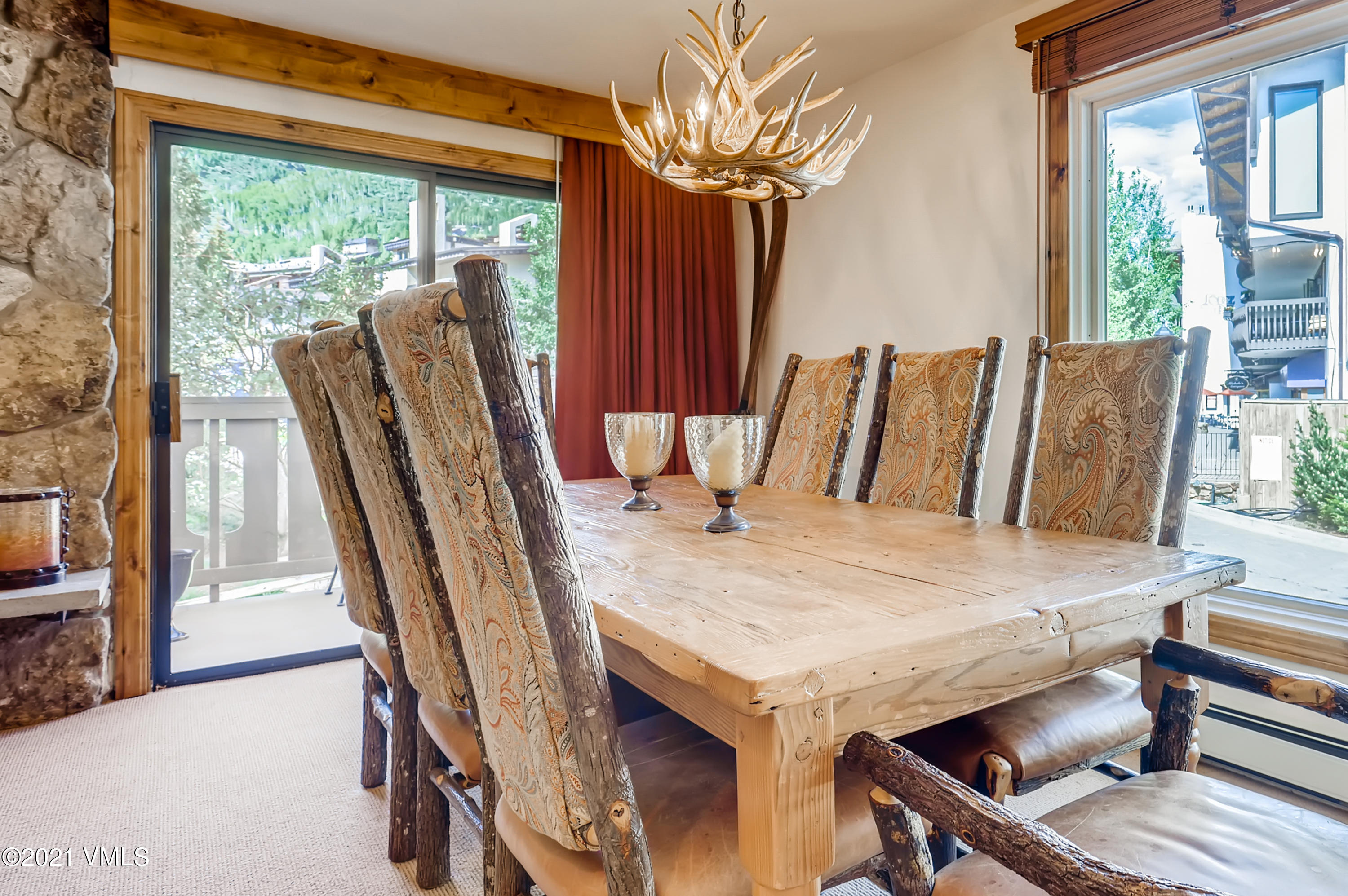133 Willow Bridge Road, Unit 625 Vail, CO 81657 - Photo 4 of 26 a view of a dining room with furniture window and outside view