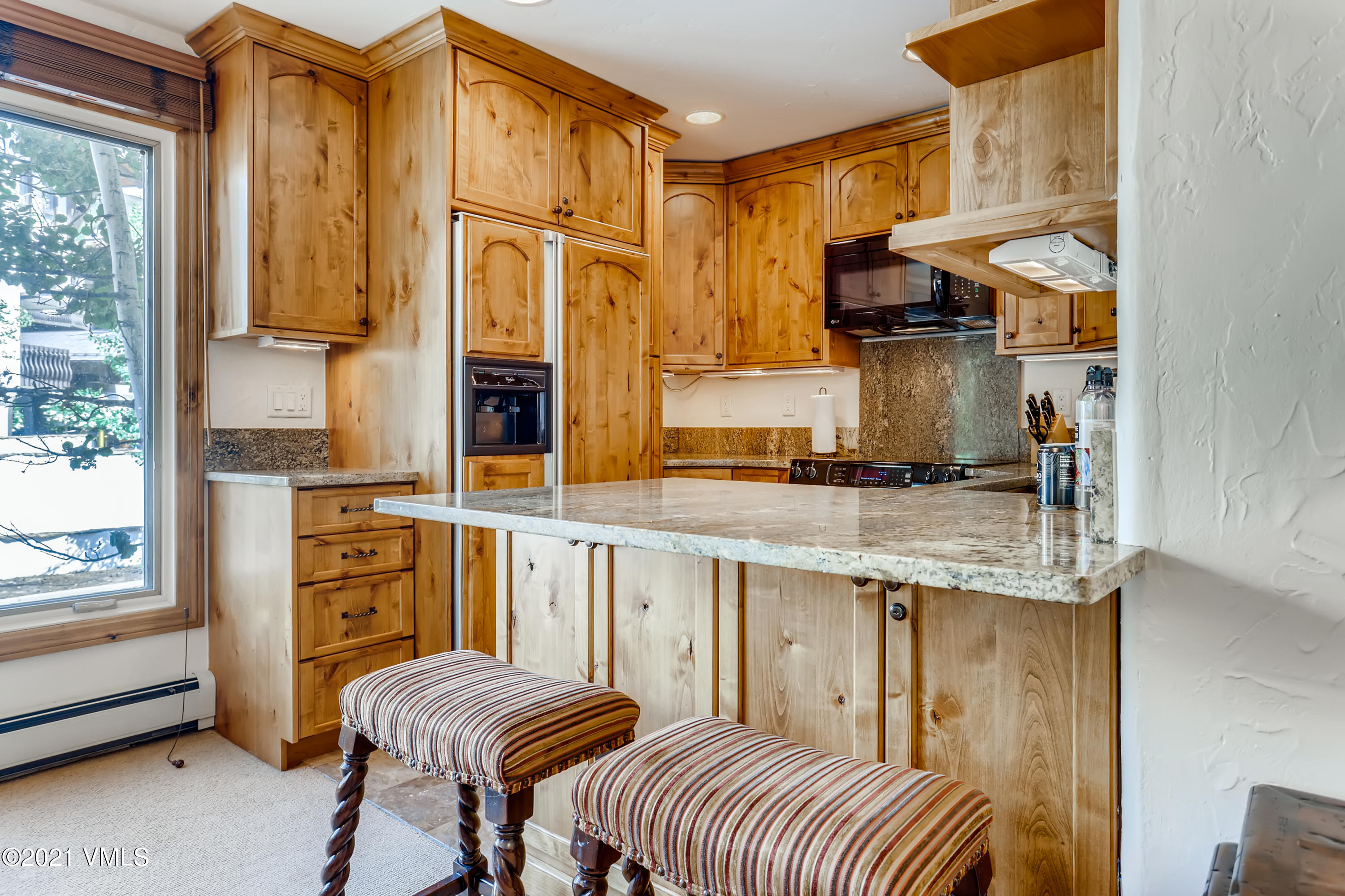 133 Willow Bridge Road, Unit 625 Vail, CO 81657 - Photo 8 of 26 a living room with stainless steel appliances granite countertop furniture and a kitchen view