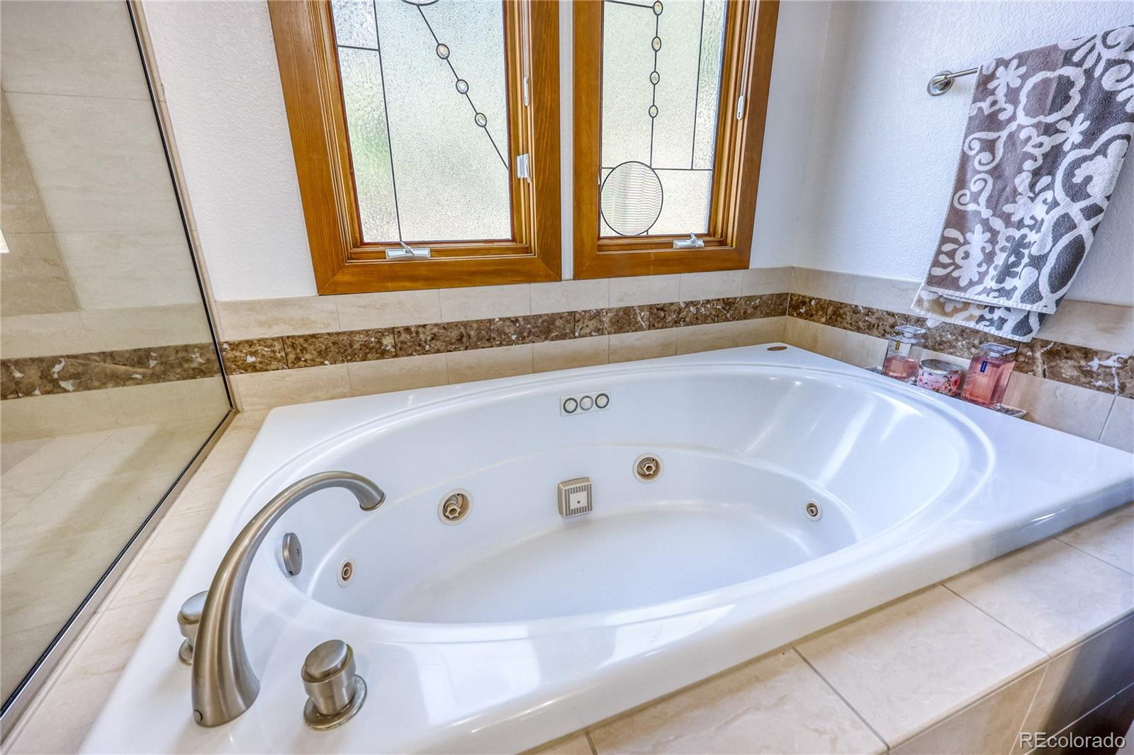 7963 Glen Ridge Drive Castle Pines, CO 80108 - Photo 19 of 48 a bath tub sitting next to a window