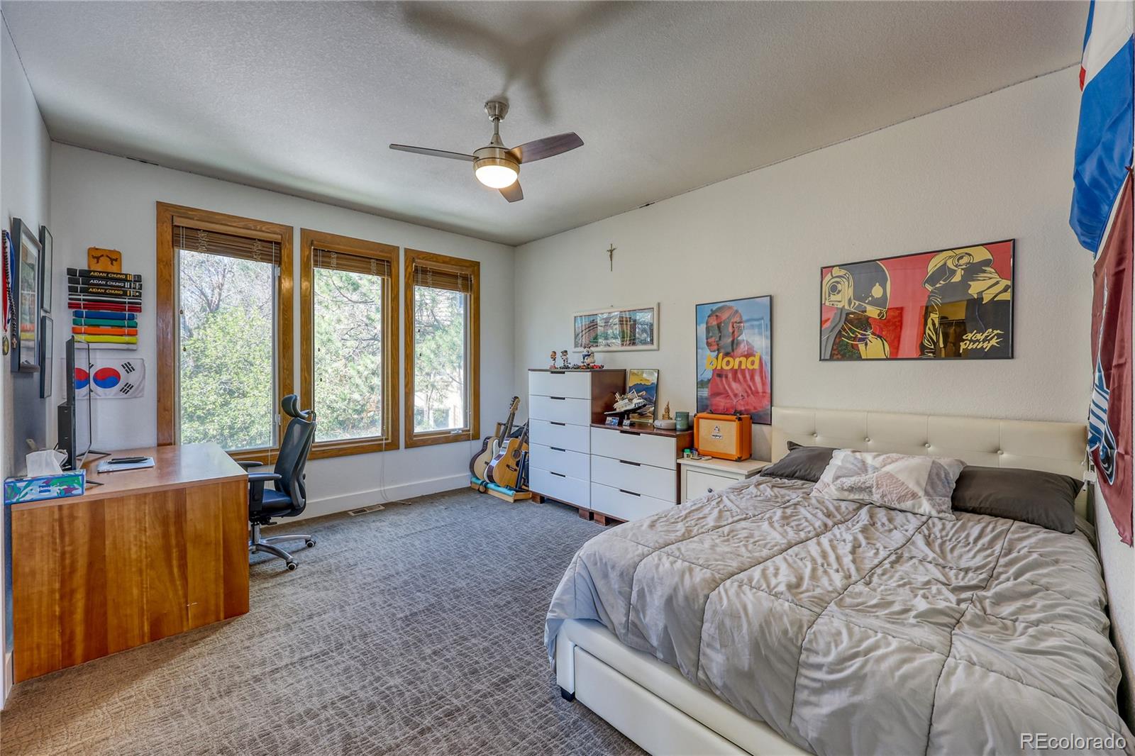 7963 Glen Ridge Drive Castle Pines, CO 80108 - Photo 22 of 48 a bed room with a bed and a couch