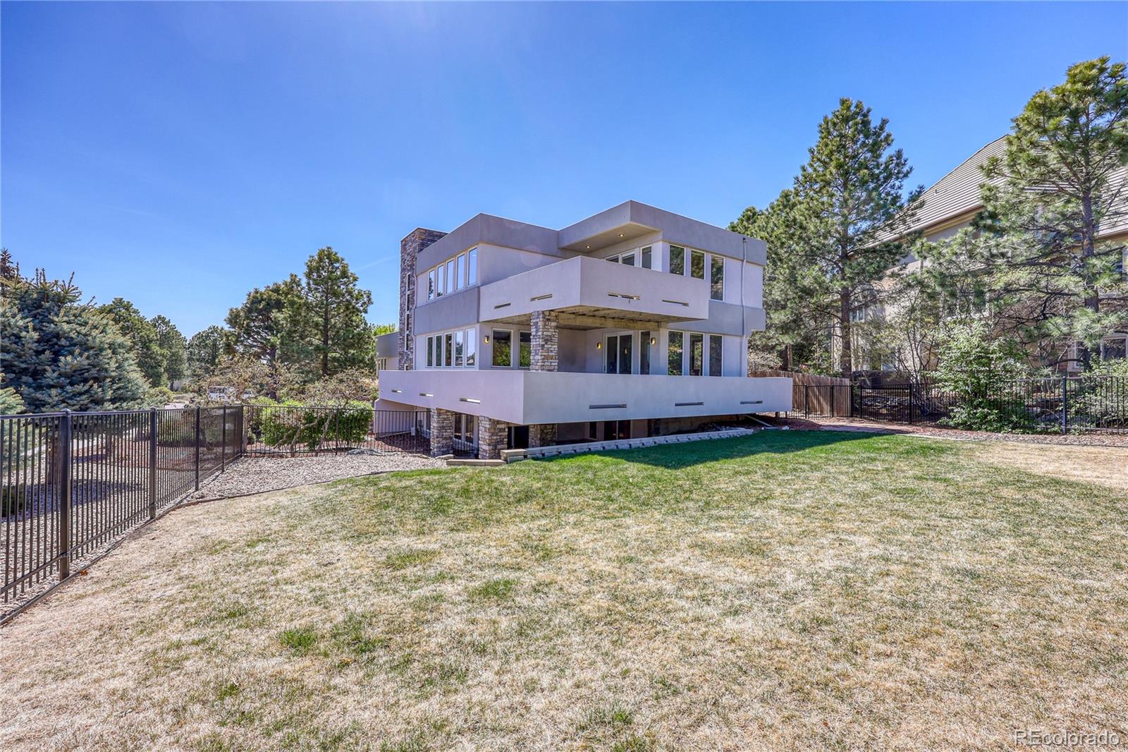 7963 Glen Ridge Drive Castle Pines, CO 80108 - Photo 43 of 48 a house view with a garden space