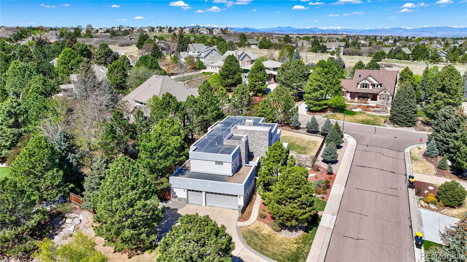 7963 Glen Ridge Drive Castle Pines, CO 80108 - Photo 44 of 48 an aerial view of a house with a yard