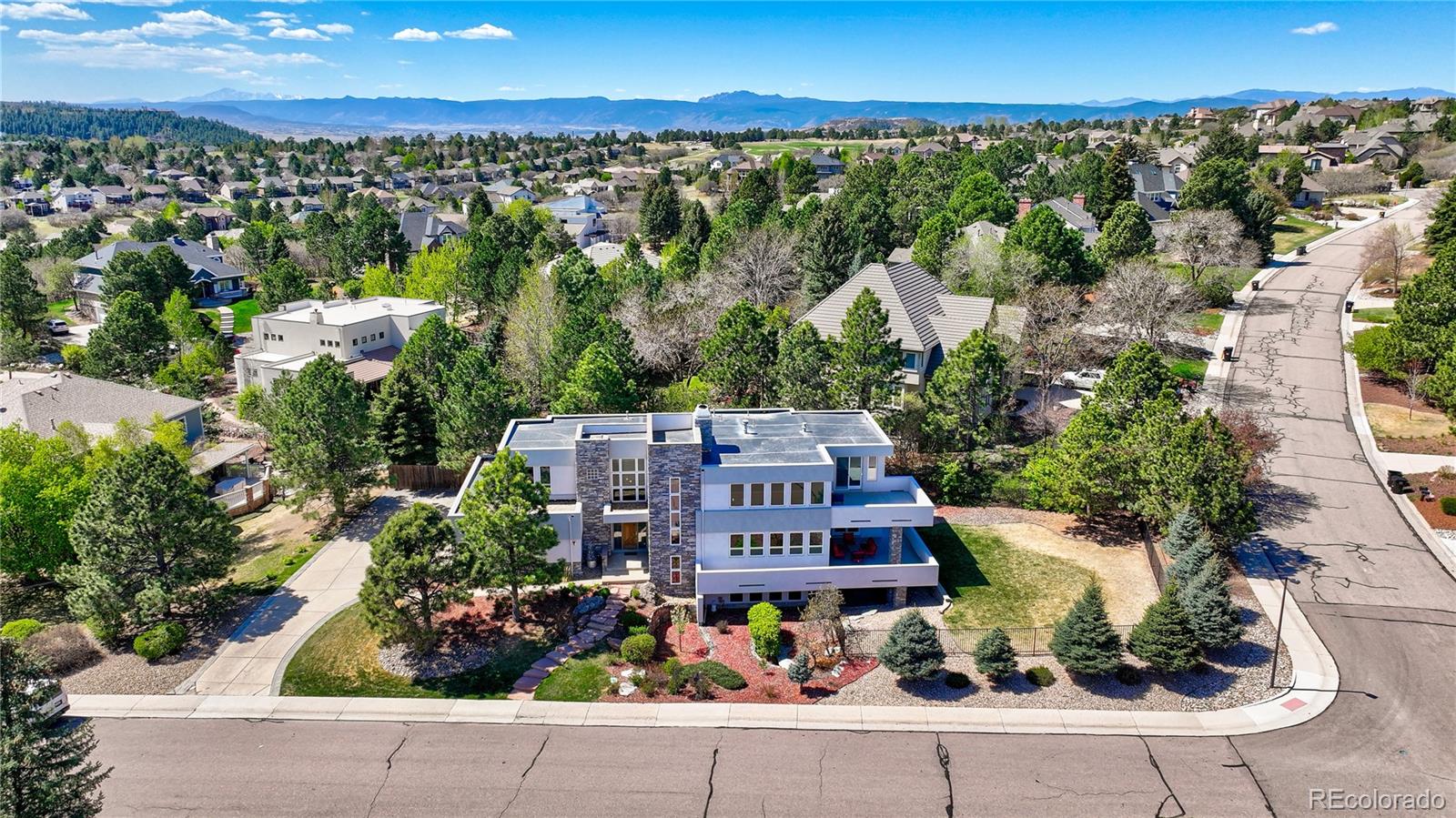 7963 Glen Ridge Drive Castle Pines, CO 80108 - Photo 45 of 48 an aerial view of a house with a garden