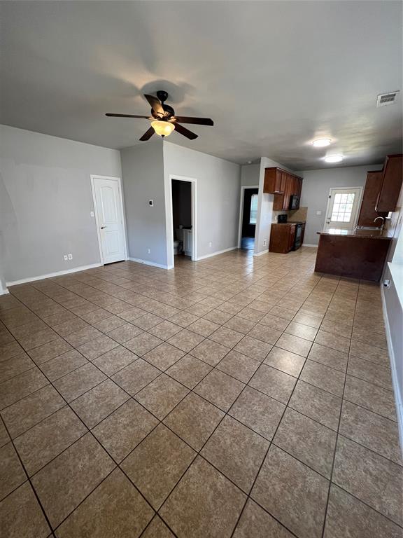 906 Parkplace Ridge Princeton, TX 75407 - Photo 14 of 25 Open-concept living space with tile flooring, a ceiling fan, and recessed lighting