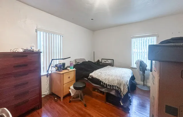 a bedroom with a bed and a dresser