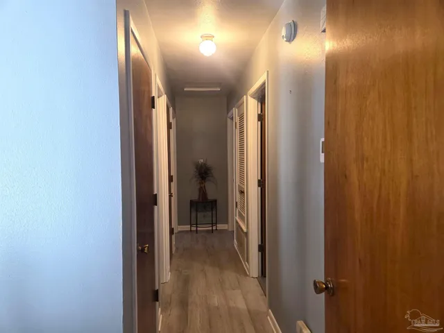 a view of hallway with a mirror