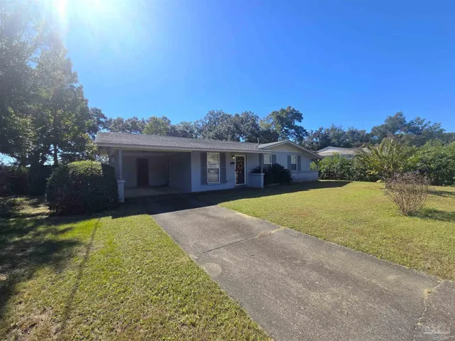 a view of house with yard and entertaining space