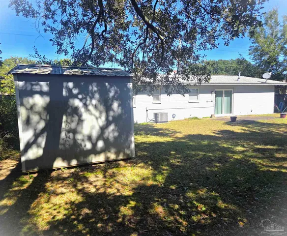 a view of yard with large tree