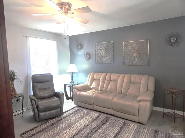 a living room with furniture and a window