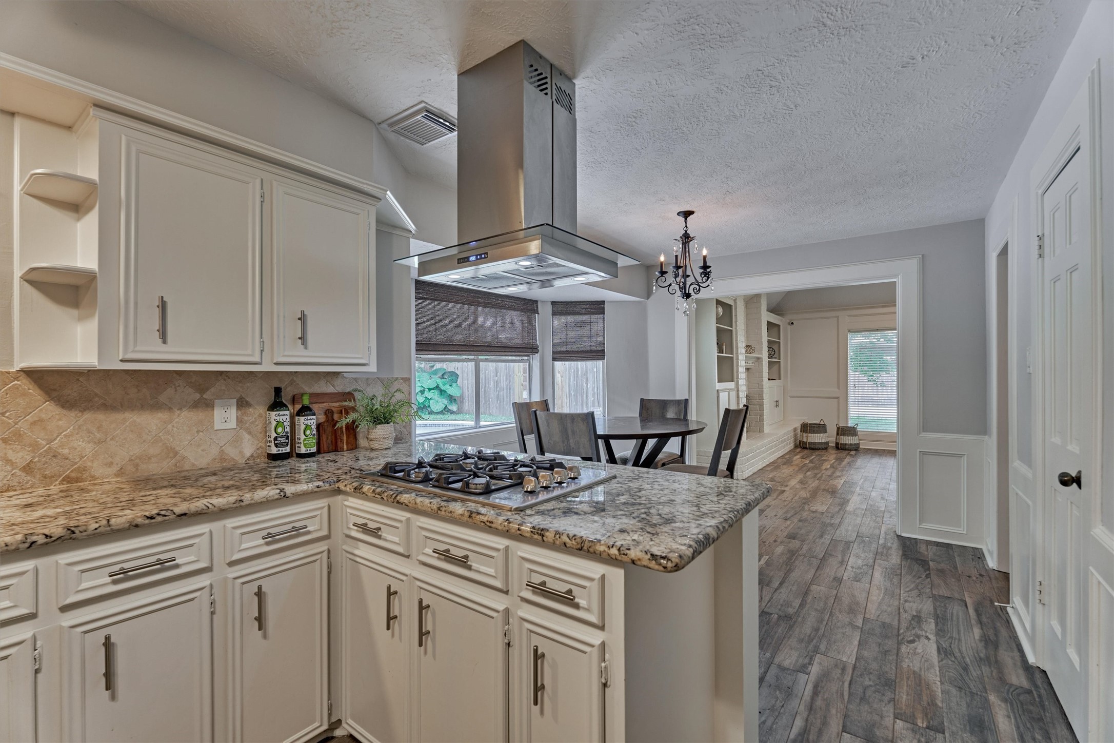 6522 Castle Pine Lane Spring, TX 77379 - Photo 24 of 49 a kitchen with stainless steel appliances granite countertop a stove and a white cabinets