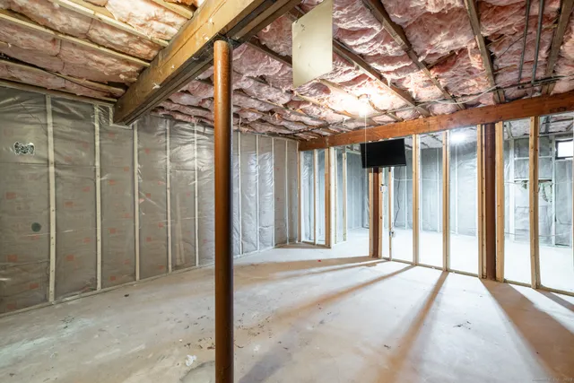 a view of a room with a large tree