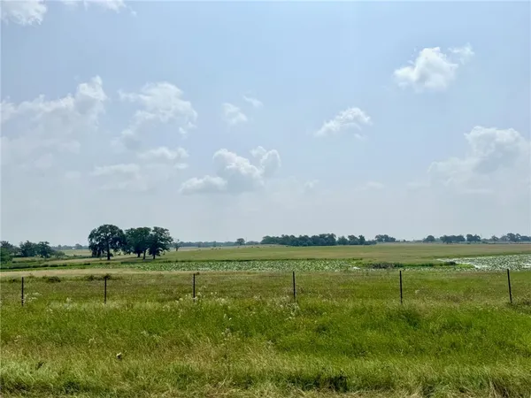 a view of a golf course with a lake