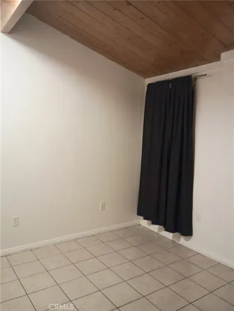 an empty room with a wooden door