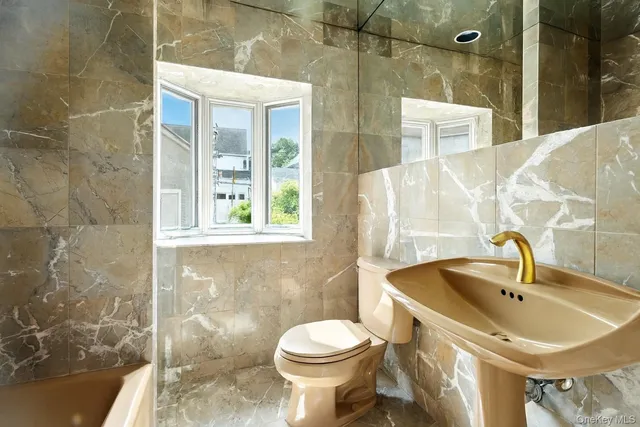 a bedroom with a bed and a book shelf