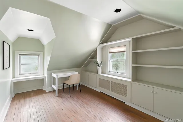 a view of an entryway with wooden floor