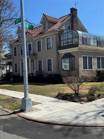 a front view of a house with street