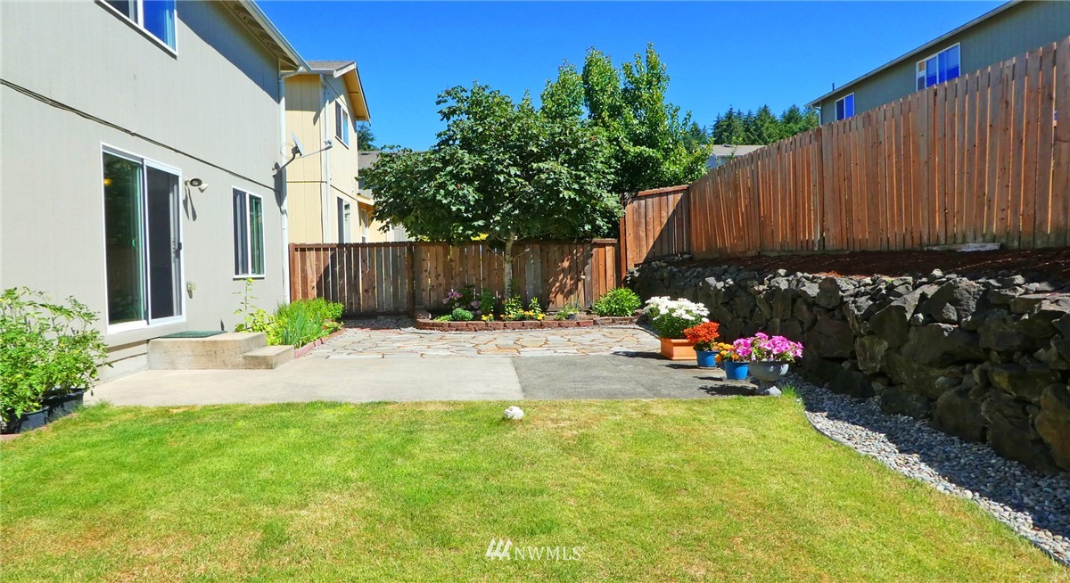 2513 Hidden Springs Loop Southeast Lacey, WA 98503 - Photo 13 of 40 a view of a back yard of the house