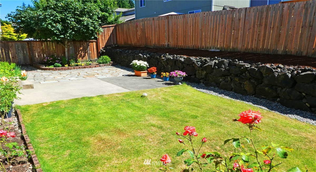 2513 Hidden Springs Loop Southeast Lacey, WA 98503 - Photo 16 of 40 a view of garden with flowers