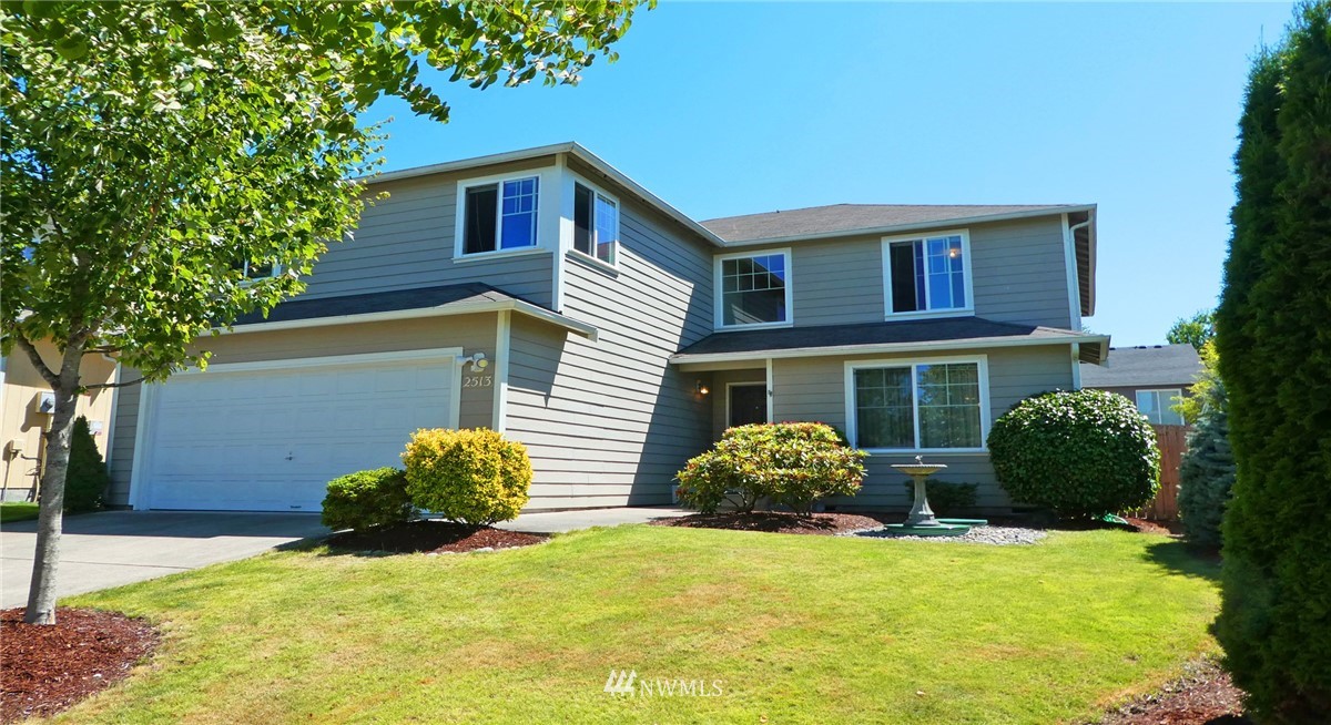 2513 Hidden Springs Loop Southeast Lacey, WA 98503 - Photo 3 of 40 a front view of a house with a yard