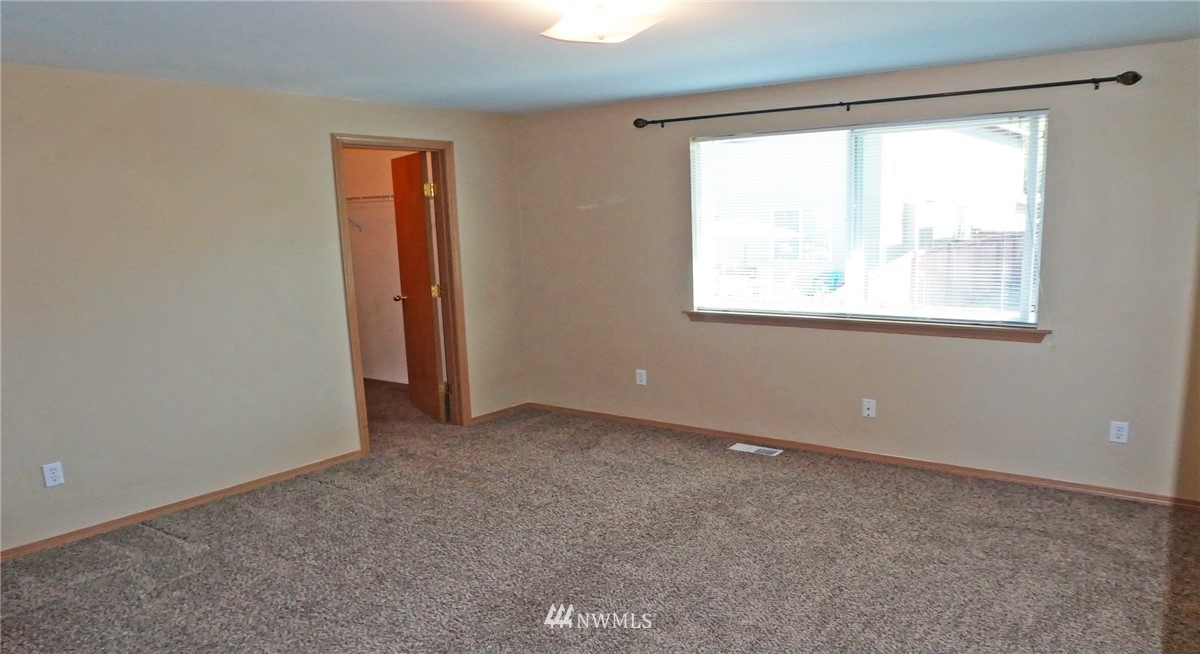 2513 Hidden Springs Loop Southeast Lacey, WA 98503 - Photo 32 of 40 an empty room with a window