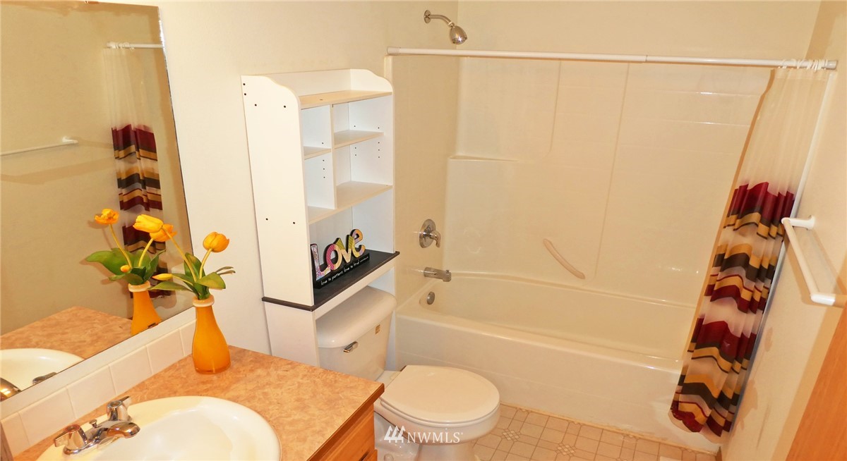 2513 Hidden Springs Loop Southeast Lacey, WA 98503 - Photo 34 of 40 a bathroom with a sink toilet and shower