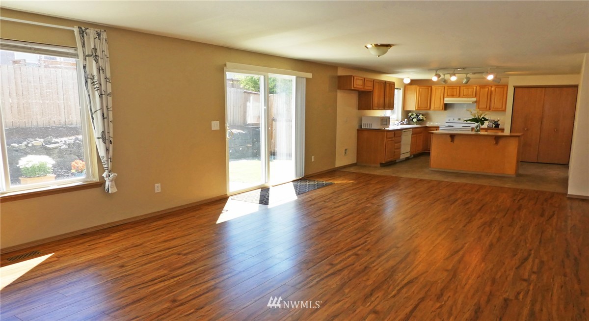 2513 Hidden Springs Loop Southeast Lacey, WA 98503 - Photo 10 of 40 a view of a kitchen with wooden floor and a kitchen