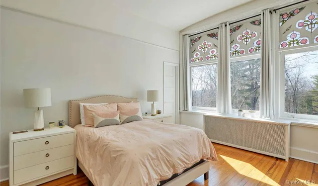 a bedroom with a large bed and a window with outer view