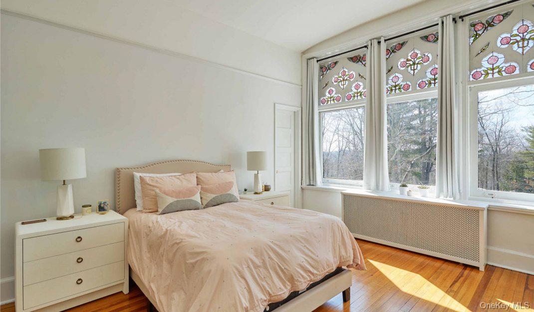 61 Crows Nest Road, Unit 6 Tuxedo Park, NY 10987 - Photo 12 of 14 a bedroom with a large bed and a window with outer view